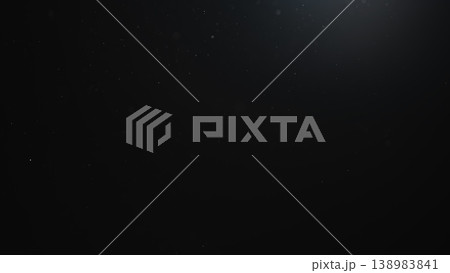 dust particles floating mid air over dark background dust particles floating mid air over dark background 138983841