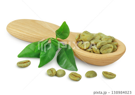 Green coffee beans in wooden spoon isolated on white background Green coffee beans in wooden spoon isolated on white background 138984023