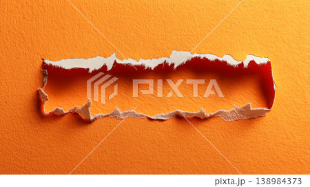 Ripped orange paper background with torn edge texture 138984373