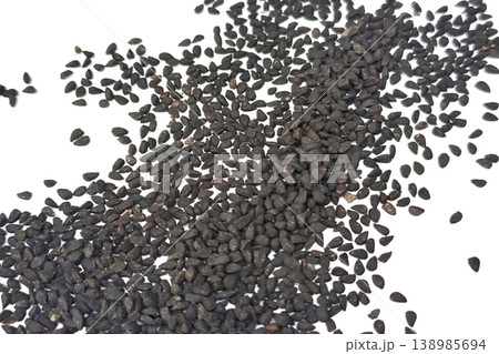 Black cumin seeds pile isolated on white background Black cumin seeds pile isolated on white background 138985694