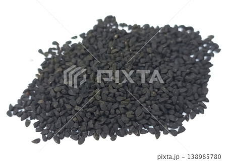 Black cumin seeds pile isolated on white background Black cumin seeds pile isolated on white background 138985780