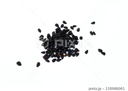 Black cumin seeds pile isolated on white background Black cumin seeds pile isolated on white background 138986061