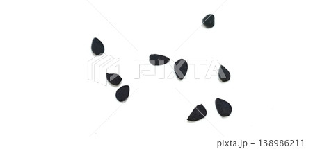 Black cumin seeds pile isolated on white background Black cumin seeds pile isolated on white background 138986211