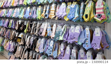 Yogyakarta, Indonesia - March 18th 2026 - Vibrant Socks Displayed on a Rack in a Store Energetic Yogyakarta, Indonesia - March 18th 2026 - Vibrant Socks Displayed on a Rack in a Store Energetic 138990114