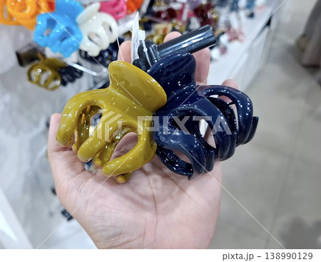 Yogyakarta, Indonesia - March 18th 2026 - Vibrant hair clips in hand on display Yogyakarta, Indonesia - March 18th 2026 - Vibrant hair clips in hand on display 138990129