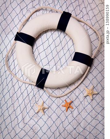 Lifebuoy on a blue grid over white background Lifebuoy on a blue grid over white background 138990159