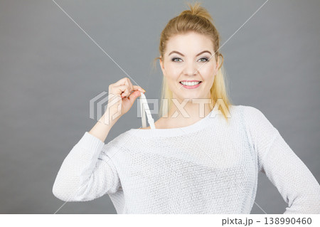 Happy woman holding her bra strap Happy woman holding her bra strap 138990460