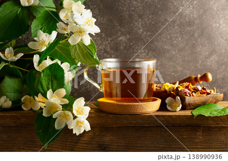 Cup of jasmine tea and fresh jasmine flowers. 138990936