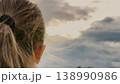 Young Girl Full of Faith, Confident Prayer Pose, Peaceful Childhood Dreaming, Girl Hoping for a Miracle, Spiritual Connection in Nature, Prayer at Dawn, Looking for a Sign, Innocent Trust in the Sky 138990986