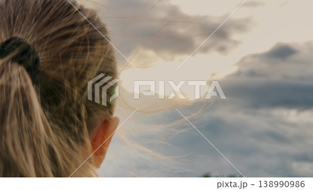 Young Girl Full of Faith, Confident Prayer Pose, Peaceful Childhood Dreaming, Girl Hoping for a Miracle, Spiritual Connection in Nature, Prayer at Dawn, Looking for a Sign, Innocent Trust in the Sky 138990986