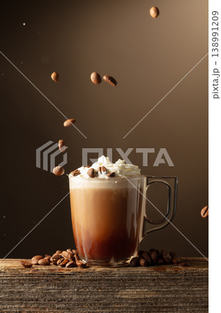 Coffee and chocolate drink with whipped cream on a brown background. Coffee and chocolate drink with whipped cream on a brown background. 138991209