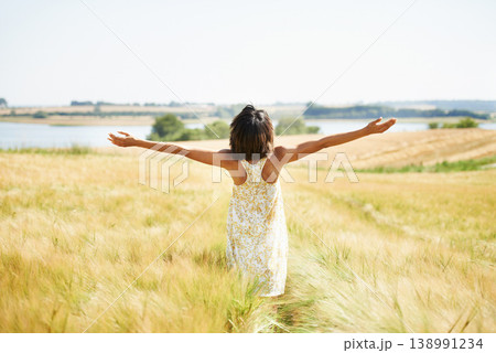 Back, freedom and woman with open arms at field in the countryside outdoor in summer mockup. Rear view, person in nature and carefree at farm, grass and enjoy fresh air on vacation, holiday or travel 138991234