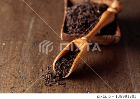 Black tea on an old wooden table. 138991283