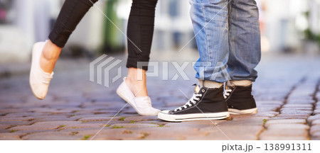 Love, city and shoes of couple on road for date, cute relationship and bonding outdoors on weekend. Dating, romance and closeup of feet of man and woman for flirting, shy and romantic adventure 138991311