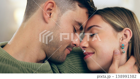 Home, relax and couple with happiness, love and care with marriage, relationship and bonding together. Cheerful people, romantic and man with woman, hug and kiss with support, peace or commitment 138991382