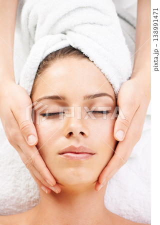 Spa massage, peace and hands on face of woman from above at resort for stress relief or wellness. Top view, facial and female client with masseuse at beauty salon for luxury, skincare or dermatology Spa massage, peace and hands on face of woman from above at resort for stress relief or wellness. Top view, facial and female client with masseuse at beauty salon for luxury, skincare or dermatology 138991471