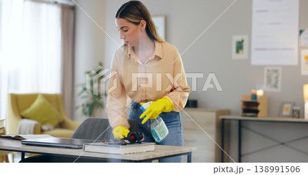 Woman, spray bottle and cleaning table in house, disinfection and maintenance service or fluid. Female person, gloves and antibacterial or detergent, chemical and hygiene or bacteria in home office 138991506