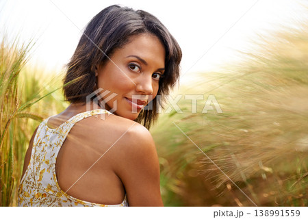 Portrait, confidence and woman in wheat field in countryside, outdoor summer for health and beauty. Face, back of person at farm grass and nature, garden and travel on holiday or vacation in Brazil 138991559