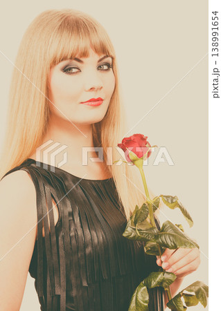 Woman gorgeous girl dark makeup holds rose flower 138991654