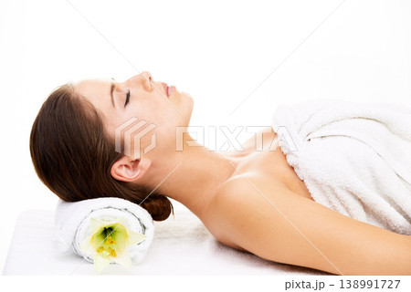Woman, sleeping and relax in spa, zen or massage lying isolated on a white studio background. Female person or model asleep in skincare for luxury body therapy, salon or treatment for stress relief Woman, sleeping and relax in spa, zen or massage lying isolated on a white studio background. Female person or model asleep in skincare for luxury body therapy, salon or treatment for stress relief 138991727