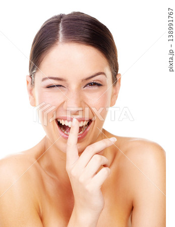 Woman, portrait and finger on lip with wink for skincare secret, wellness and cosmetic in studio. Person, face and happiness or confidence for facial treatment, beauty and topless on mock up space 138991767