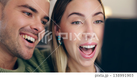 Happy couple, sofa and tablet in home, relax and excited for reading web blog, movie or funny meme in living room. Man, woman and digital touchscreen with comic laugh for social media post in lounge 138991903