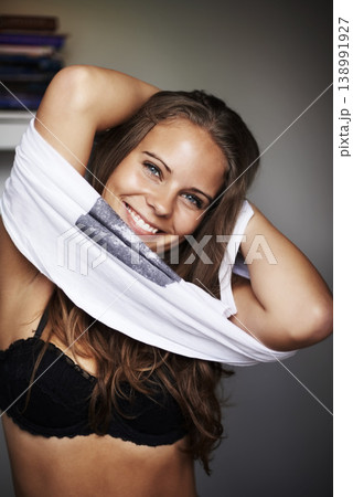 Lingerie, woman and happy portrait with dressing, smile and relax in a bedroom with underwear and calm. Shirt, fashion and confidence with proud at home with clothing decision and choice at morning 138991927