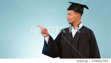 Education, graduation and a student man pointing to space in studio on a blue background for marketing. School, university or college with a confident young graduate on mockup for advertising 138992365