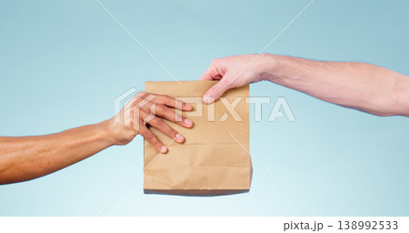 Hands, paper bag and delivery in studio closeup for fast food, supply chain and cargo by blue background. Courier, logistics and package for service, shipping and giving to customer for e commerce Hands, paper bag and delivery in studio closeup for fast food, supply chain and cargo by blue background. Courier, logistics and package for service, shipping and giving to customer for e commerce 138992533