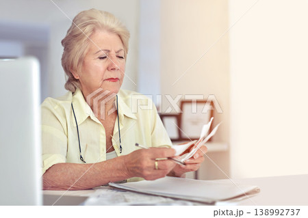 Senior woman, planning budget and retirement or paperwork for tax, financial documents or receipt, investment or savings. Elderly person, finance or money or pension, bills or debt management Senior woman, planning budget and retirement or paperwork for tax, financial documents or receipt, investment or savings. Elderly person, finance or money or pension, bills or debt management 138992737