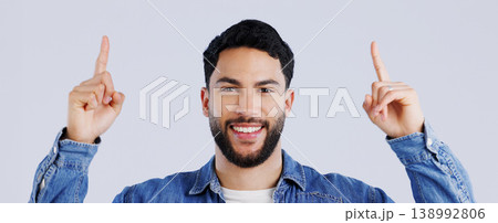 Happy man, portrait and pointing up on mockup for deal, advertising or marketing against a gray studio background. Face of male person or model showing notification, alert or sale for discount promo Happy man, portrait and pointing up on mockup for deal, advertising or marketing against a gray studio background. Face of male person or model showing notification, alert or sale for discount promo 138992806