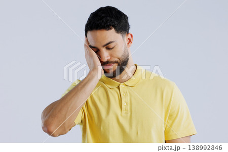 Stress, burnout and a young asian man in studio isolated on a white background for mental health. Anxiety, headache and the hands of a sad person on his face in frustration for worry or a mistake Stress, burnout and a young asian man in studio isolated on a white background for mental health. Anxiety, headache and the hands of a sad person on his face in frustration for worry or a mistake 138992846