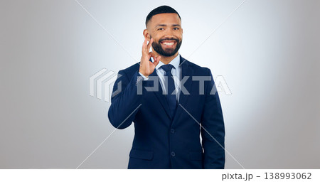 Portrait, yes and corporate businessman in studio with smile, ok gesture for deal announcement and mockup space. Thank you, agreement and happy man with gratitude, opinion or vote on white background Portrait, yes and corporate businessman in studio with smile, ok gesture for deal announcement and mockup space. Thank you, agreement and happy man with gratitude, opinion or vote on white background 138993062