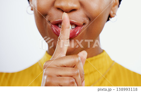Secret, woman and hands with finger on lips in studio for privacy, confidential deal and surprise on white background. Closeup, mouth and face of model with quiet emoji for gossip, news and whisper Secret, woman and hands with finger on lips in studio for privacy, confidential deal and surprise on white background. Closeup, mouth and face of model with quiet emoji for gossip, news and whisper 138993118