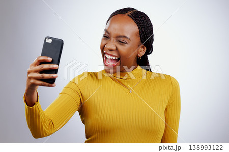 Happy woman, selfie or video call for social media, influencer content creation and online blog on a white background. African person with smile and excited for profile picture photography in studio Happy woman, selfie or video call for social media, influencer content creation and online blog on a white background. African person with smile and excited for profile picture photography in studio 138993122