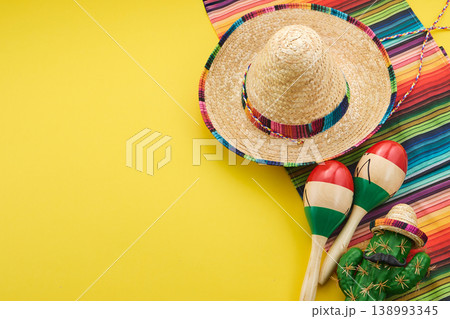 Mexican fiesta celebrating cinco de mayo with sombrero and maracas 138993345