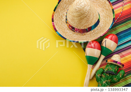Mexican fiesta elements with sombrero maracas and cactus Mexican fiesta elements with sombrero maracas and cactus 138993347