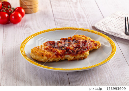 Roasted breaded crispy pork schnitzel Roasted breaded crispy pork schnitzel 138993609