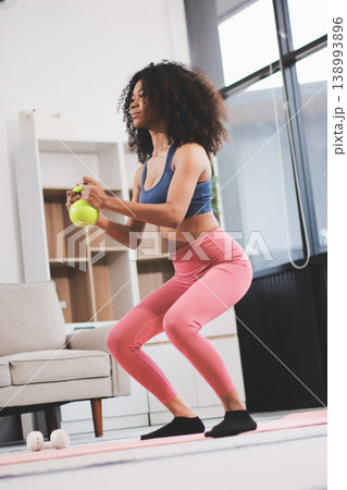 Women exercising in fitness studio yoga classes Women exercising in fitness studio yoga classes 138993896