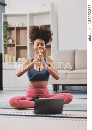 Women exercising in fitness studio yoga classes Women exercising in fitness studio yoga classes 138993898