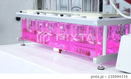 Sciene laboratory. Close up of Modern laboratory scenes with glassware tube reactors and colorful liquids in testing and analysis processes. Chemistry research pharmaceuticals biotechnology concepts. Sciene laboratory. Close up of Modern laboratory scenes with glassware tube reactors and colorful liquids in testing and analysis processes. Chemistry research pharmaceuticals biotechnology concepts. 138994316