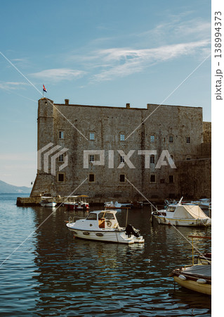 Amazing view of Dubrovnik and the boat in a marina on a sunny day. Travel destination in Croatia. Amazing view of Dubrovnik and the boat in a marina on a sunny day. Travel destination in Croatia. 138994373