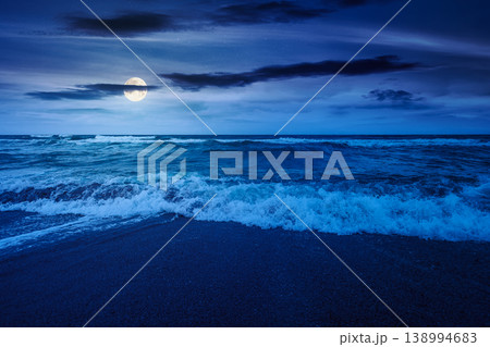 storm on the sandy beach at night. wonderful sea view with cloudy sky. full moon over salt water and crashing waves. mysterious view of bulgaria beach in summer. wind weather background 138994683