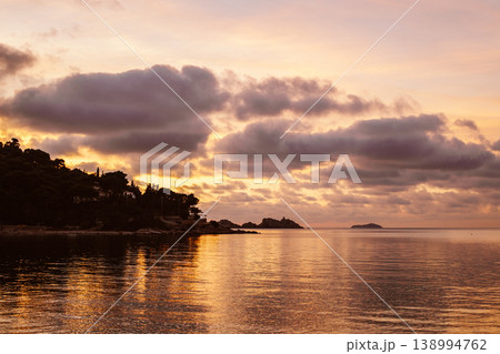 Amazing sunset and the Adriatic sea near Dubrovnik city, Croatia. Travel destination in Croatia. Amazing sunset and the Adriatic sea near Dubrovnik city, Croatia. Travel destination in Croatia. 138994762