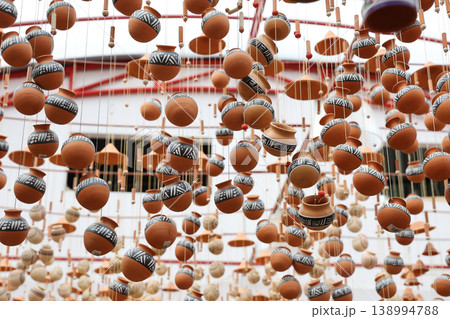 Beautiful handmade wind chimes made of clay at the small town of Raquira also known as The City of Pots in Colombia Beautiful handmade wind chimes made of clay at the small town of Raquira also known as The City of Pots in Colombia 138994788