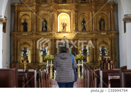 Senior woman praying at the beautiful historical Our Lady of the Rosary Church built in 1604 in the colonial town of Villa de Leyva in Colombia Senior woman praying at the beautiful historical Our Lady of the Rosary Church built in 1604 in the colonial town of Villa de Leyva in Colombia 138994794
