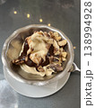Sweet ice cream in a bowl on the table in a coffee shop. 138994928