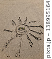 Smiling Sun Drawing on Sand Wearing Sunglasses Beach Summer Concept 138995164