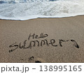 Hello Summer Written in Sand with Sea Foam Top View Beach Concept 138995165