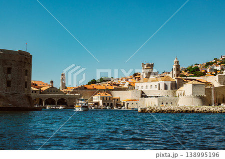 Amazing view of Dubrovnik old city and the boats in a marina on a sunny day. 138995196